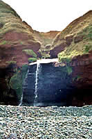 The stream carving its way down to the shore.